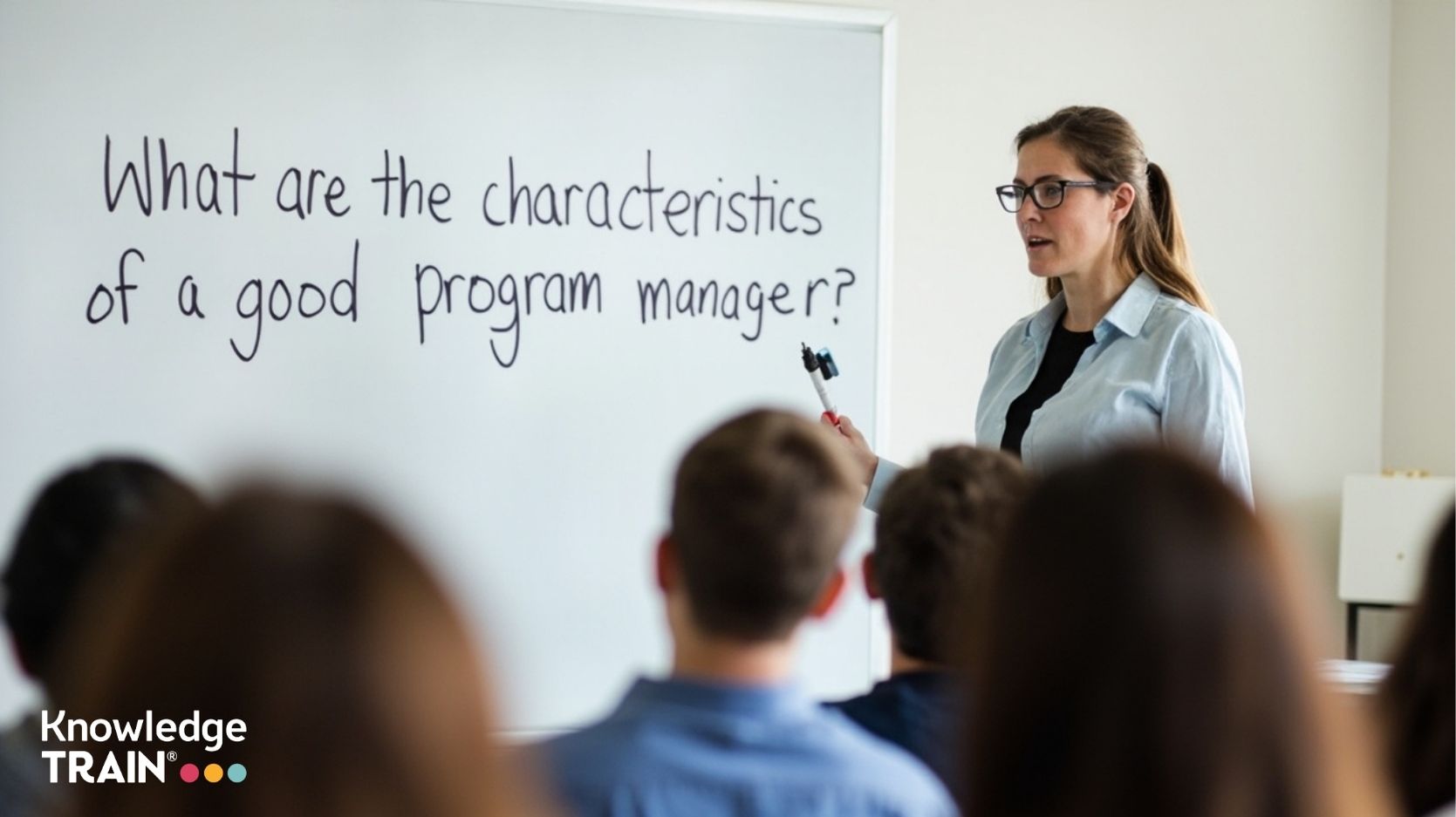 What are the characteristics of a good program manager?