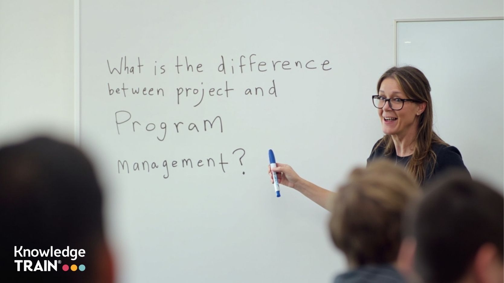 What is difference between project and program management?