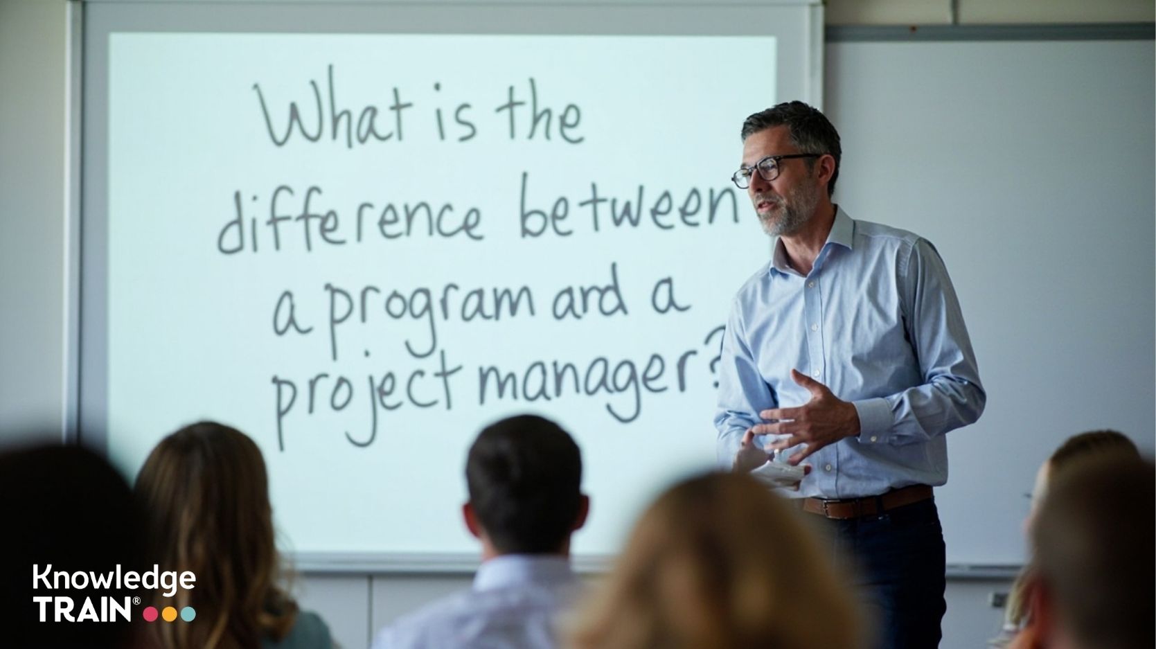 What is the difference between program and project manager?